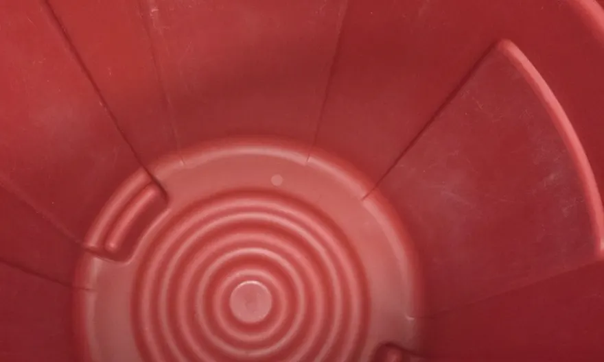 The same trash can after cleaning, scrubbed back to bare clean plastic.